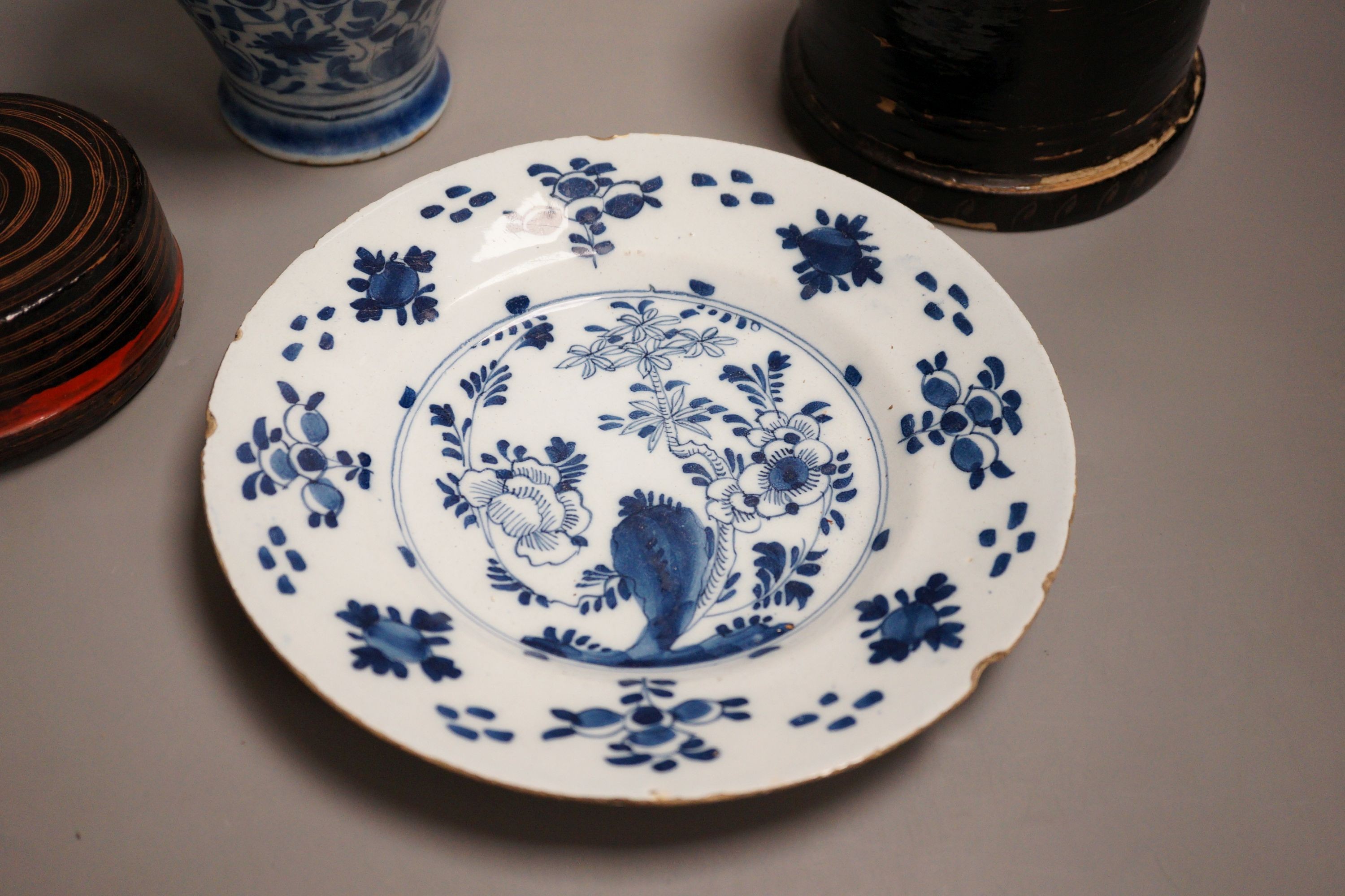 An 18th century Delft blue and white vase, a similar plate and two papier mache boxes, plate diameter 23cm